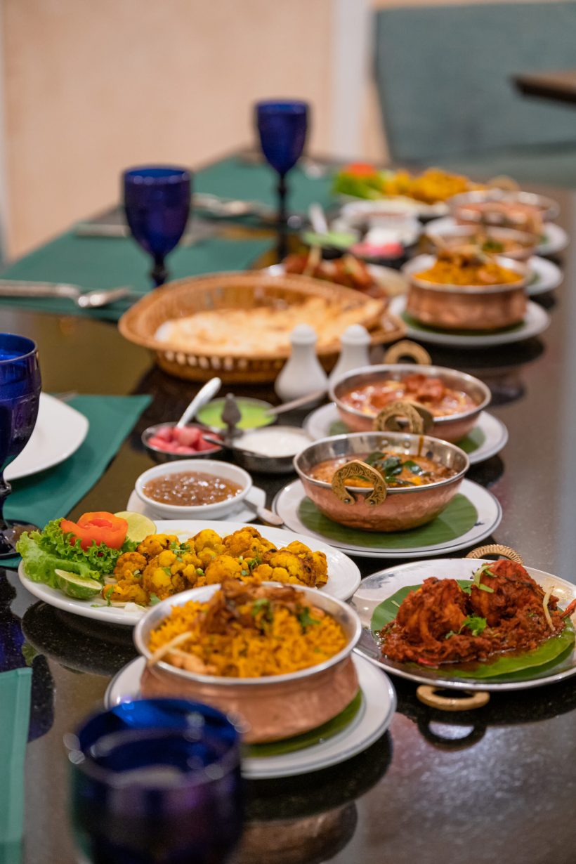 Various Indian food with meat, curry, soup and spicy taste on the table in restaurant